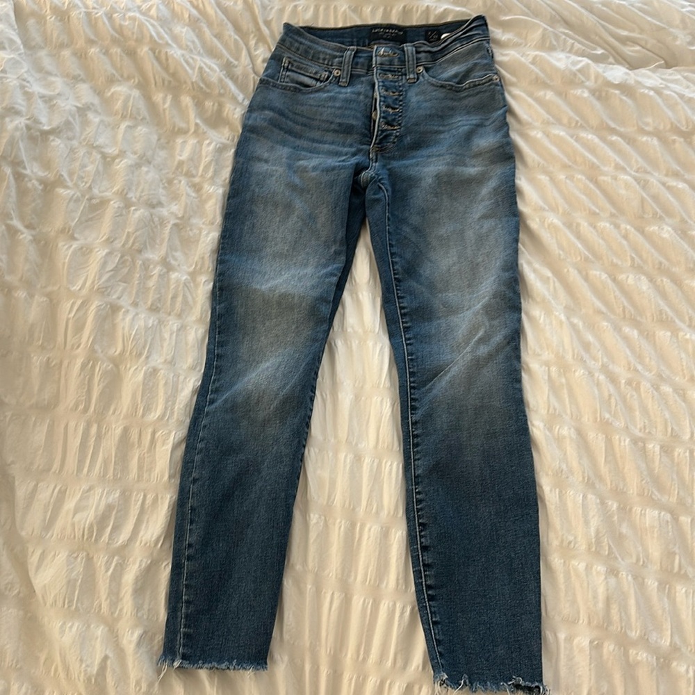 Lucky Brand button up high rise skinny ankle length jeans.